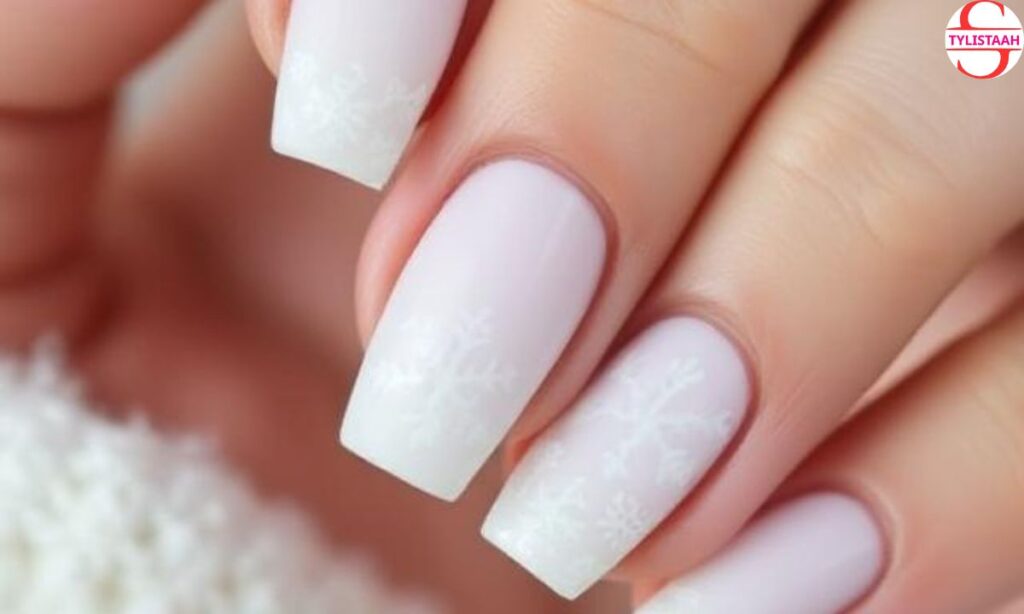 white-and-nude-snowflakes-nails