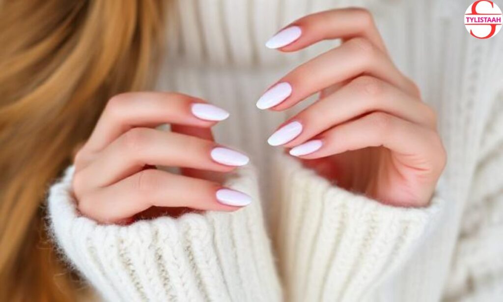 white-sweater-and-french-tip-nails